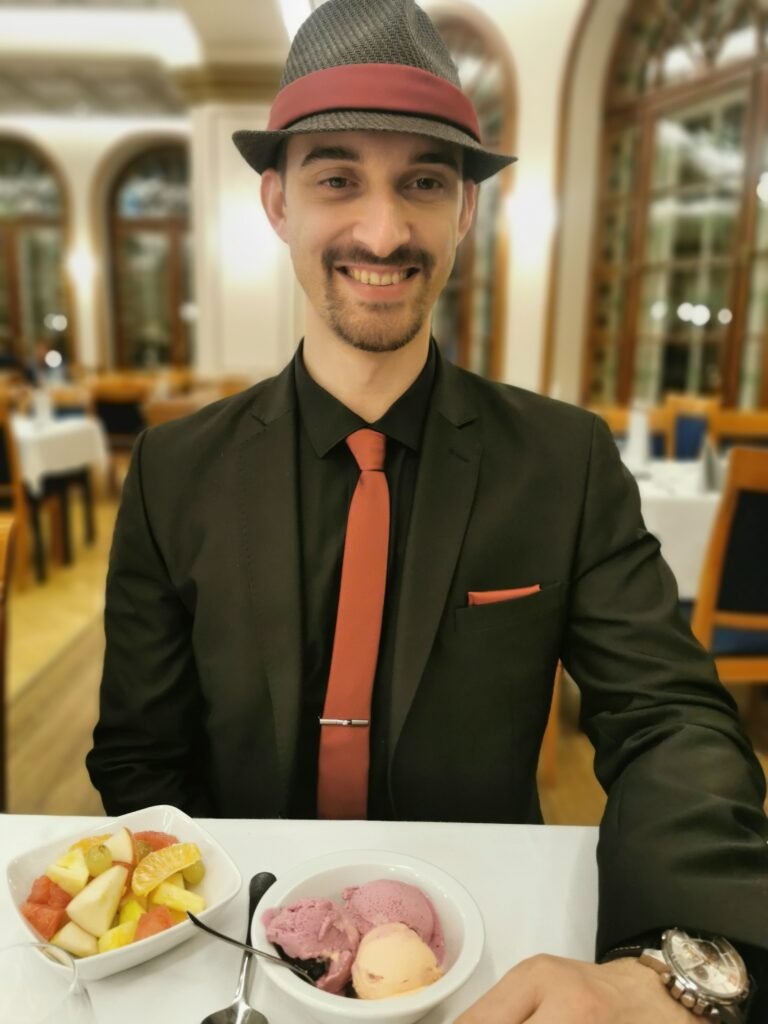 husband never plans dates - the man in a suit sitting and eating ice cream on a date